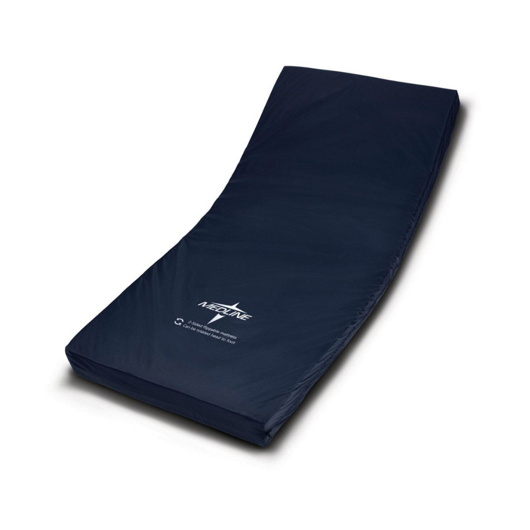 The Medline Homecare Semi-Electric Bed features a dark blue, contoured foam mattress with printed text and logo. Lightweight for patient convenience, the mattress curves upward at one end and is displayed on a white background. Height adjusts from 15–20.